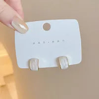 Gold-Arched Drop Oil Beige Earrings