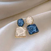 Asymmetric blue stud earrings